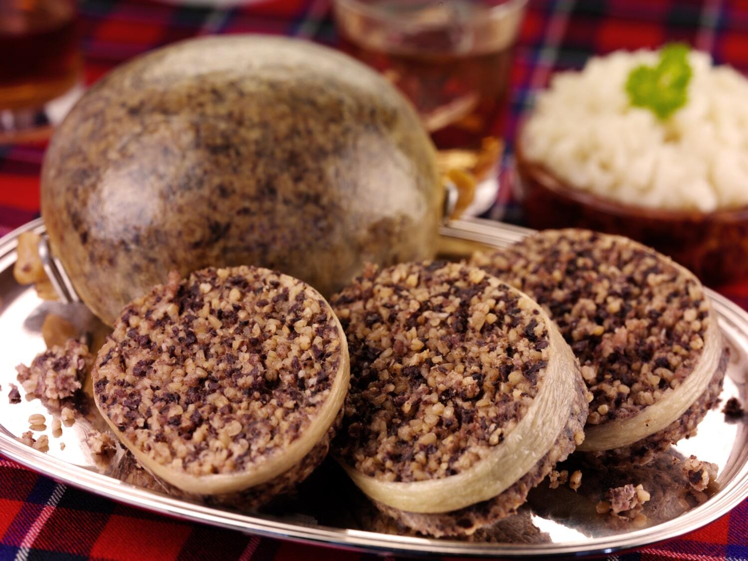 Scottish haggis served on a silver platter Scottish haggis served on a silver platter