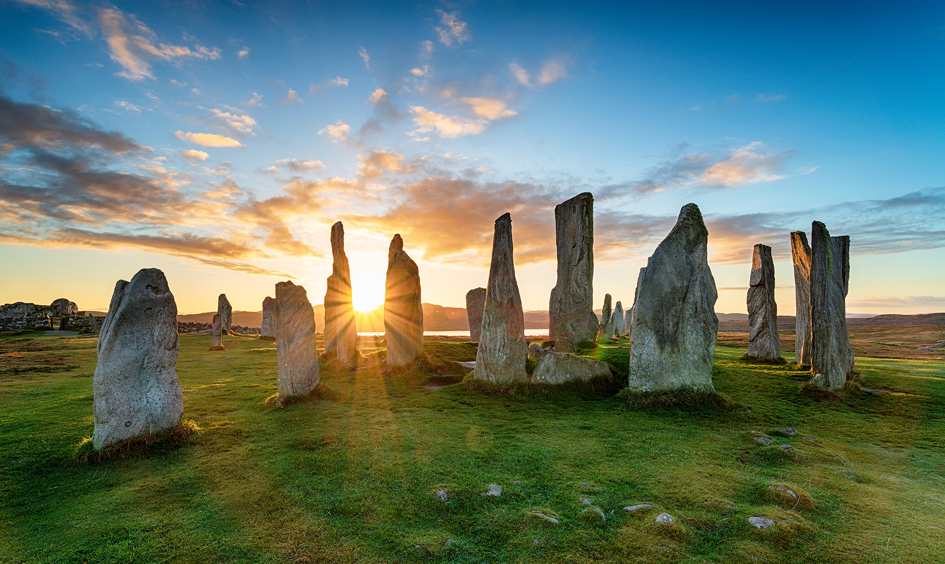 Sunset over the stone circle at Callanish on the Isle of Lewis in Scotland