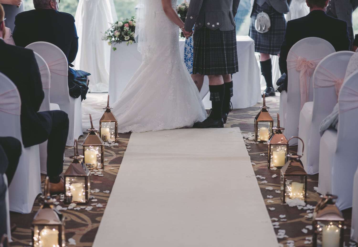 A bride and groom getting married at a Scottish wedding