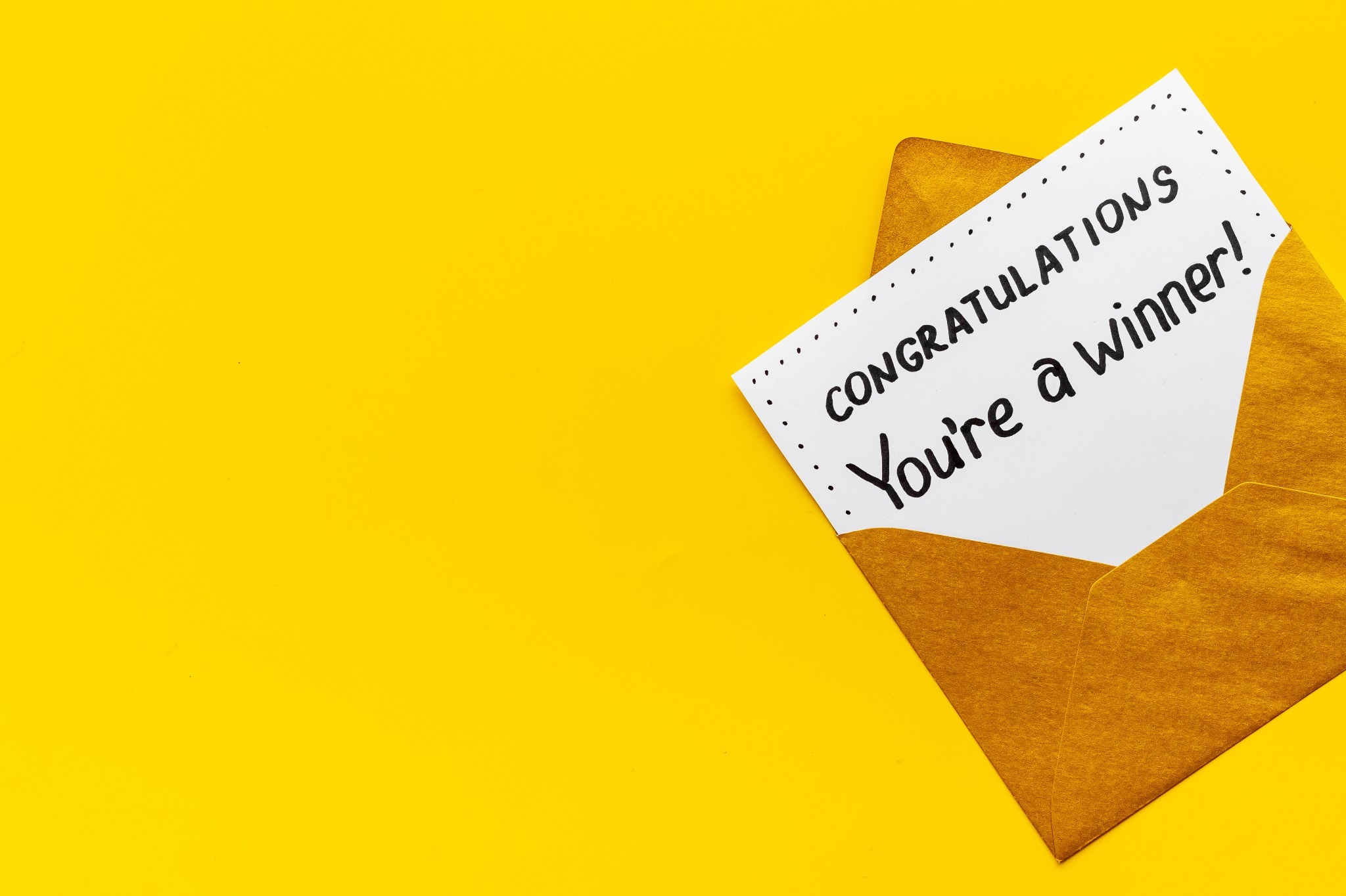 A card that says congratulations, symbolizing the Welsh word 