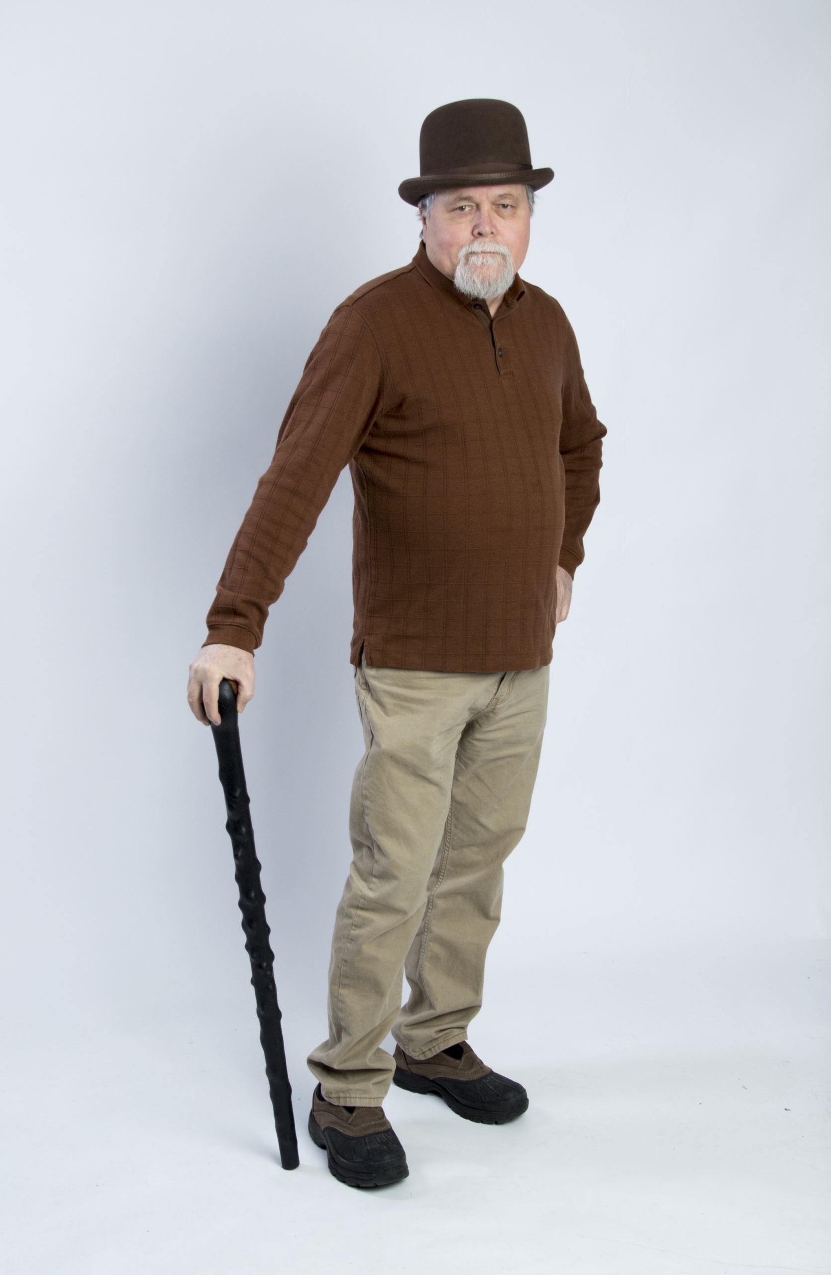 A man using a Shillelagh as a walking stick,a nd not for Irish stick fighting
