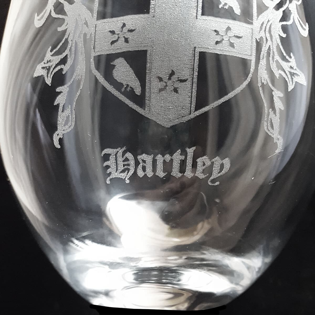 coat of arms etched on glass
