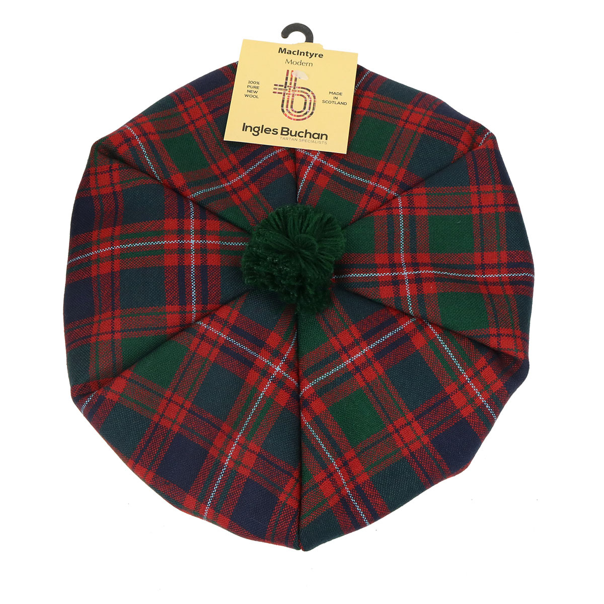 What is a tam? A top down view of a Macintyre tam o shanter. Red, navy, and green tartan with a green pom pom. What is a tam? A top down view of a Macintyre tam o shanter. Red, navy, and green tartan with a green pom pom.