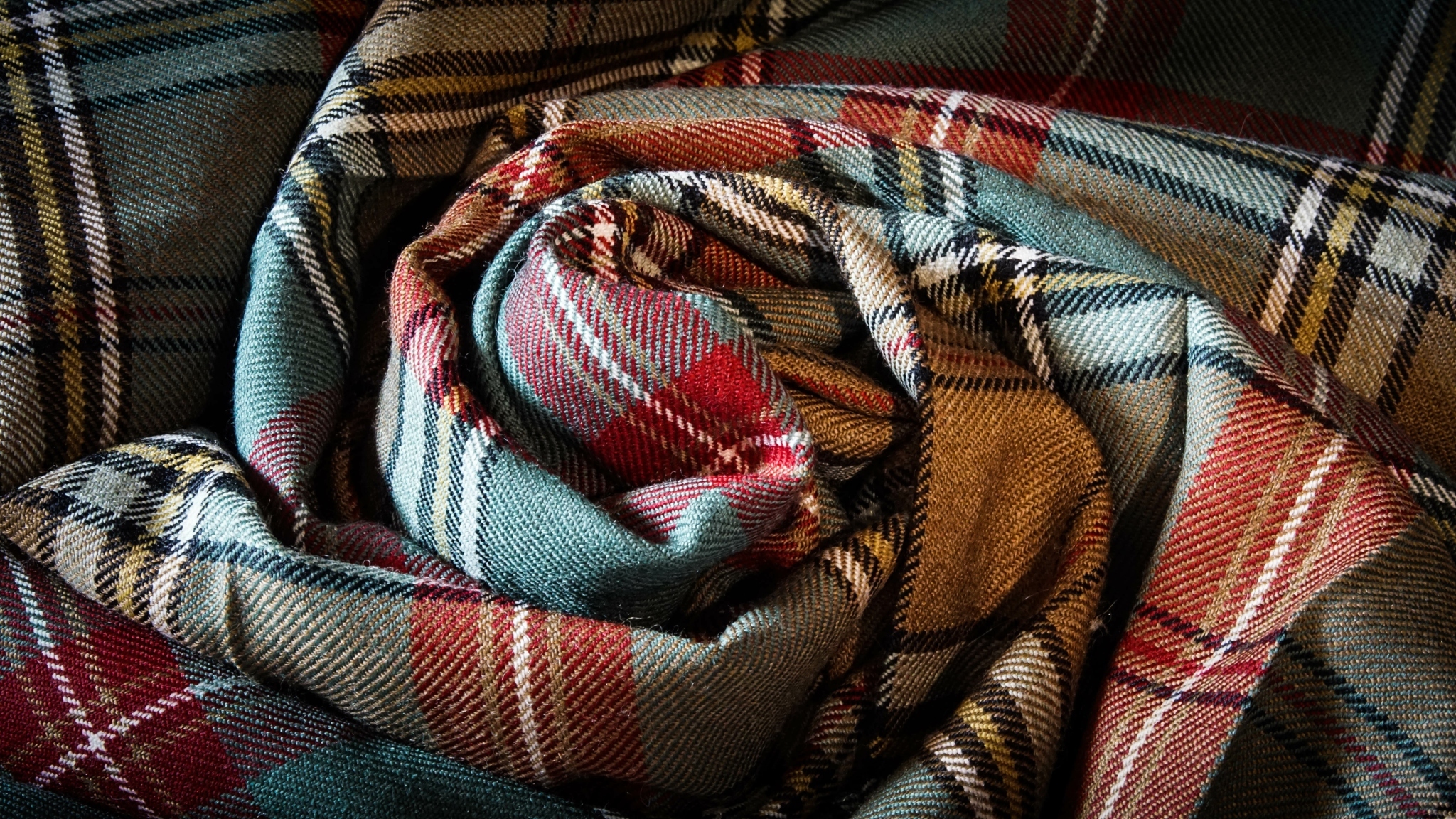 Tartan fabric posed in a twirl Tartan fabric posed in a twirl
