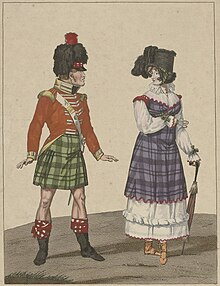 A Scottish man in kilts standing next to a Lady