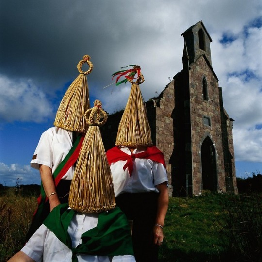 people with straw hats covering their head people with straw hats covering their head