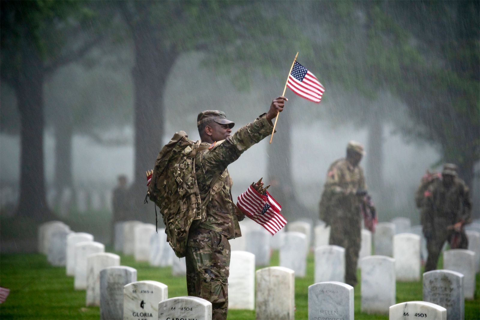 An American soldier holding the American flag