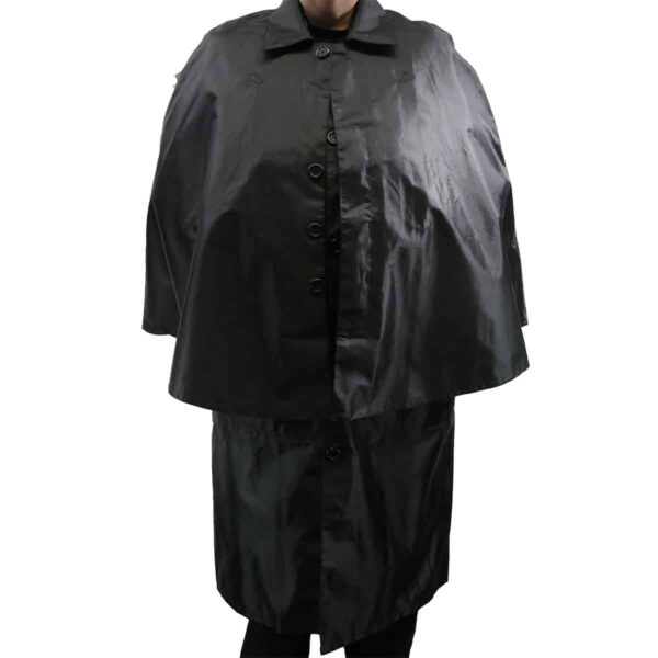 A woman wearing a black Standard Inverness Piper Rain Cape.