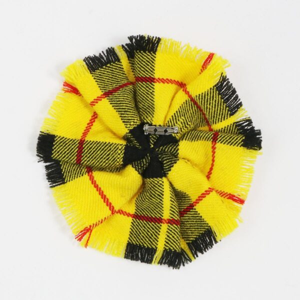 A MacLeod of Lewis Modern Wool-Blend Tartan Rosette with yellow and black patterning, placed on a white surface is the MacLeod of Lewis Modern Wool-Blend Tartan Rosette.