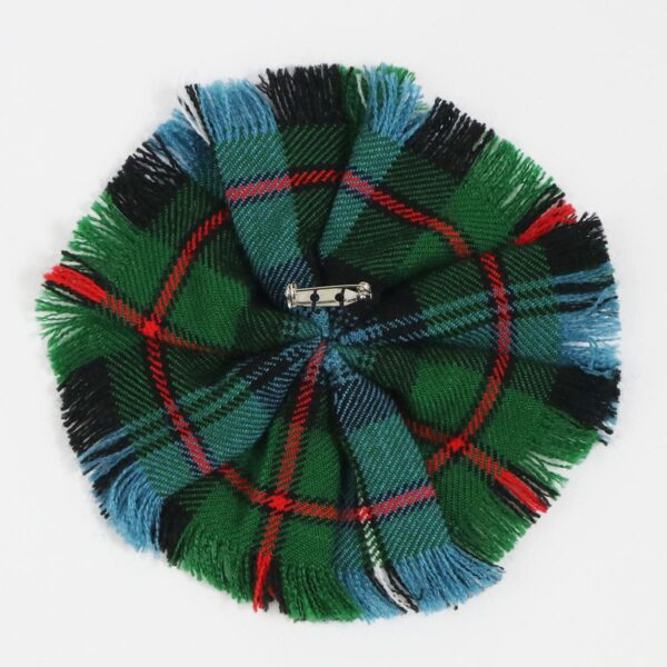 A green and black Robertson Hunting Ancient Wool-Blend Tartan Rosette hat with tassels.