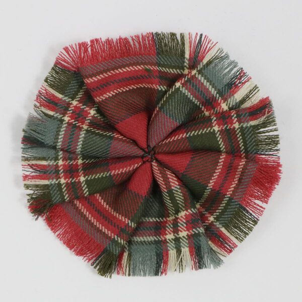 A MacFarlane Weathered Light Weight 11oz Wool Tartan Rosettes pom pom on a white surface.