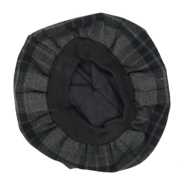 A black and grey Night Watch Tartan Tam on a white background.