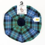 A green and blue MacNeil of Barra Ancient Spring Weight Tartan Tam-sold with a pom pom.