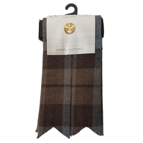 Brown and gray plaid OUTLANDER Poly/Viscose Tartan Flashes with a hanger and a tag that reads "Made in Scotland." This stylish accessory, inspired by Outlander, is crafted from Poly/Viscose material for added comfort and durability.