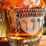 An Irish Coat of Arms 23.75oz Decanter and Whisky Glass Set, featuring a coat of arms and holding up to 23.75oz of liquid, perfect for use as a decanter or whisky glass.