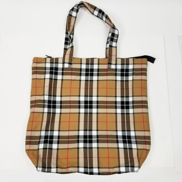 A Thompson Camel Modern Tartan Travel Bag - Poly/Viscose Wool Free featuring the iconic burberry check pattern, placed on a pristine white surface.