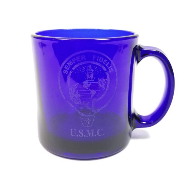 A blue US Marine Etched coffee mug with the USMC logo on it.