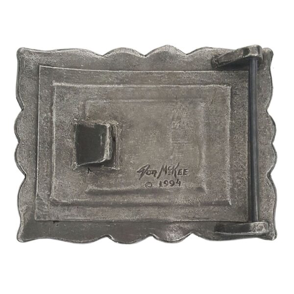 The Don McKee Celtic Knot Kilt Belt Buckle in silver, featuring a black handle.