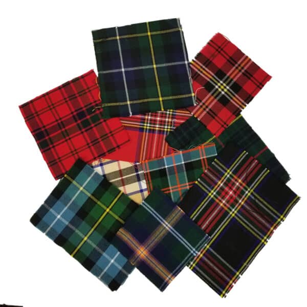 Ten pieces of fabric from the Assorted Tartan Swatches Craft Bag, each showcasing vibrant tartan patterns, are arranged in a scattered formation against a white background.