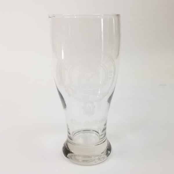 This 19 oz MacKenzie Clan Crest pilsner glass features a clear glass design with an embossed clan crest and the text "Clan MacKenzie," capturing the charm of traditional beer mugs.