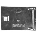 A metal plate with a lock on it featuring the Don McKee U.S. Marine Corps USMC Kilt Belt Buckle 80/20.