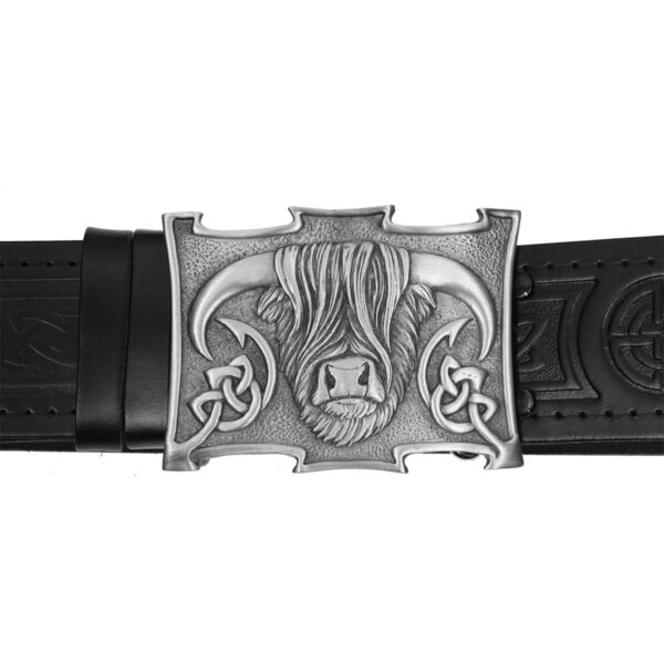 An Heilan Coo antiqued kilt belt buckle with a celtic design on it.