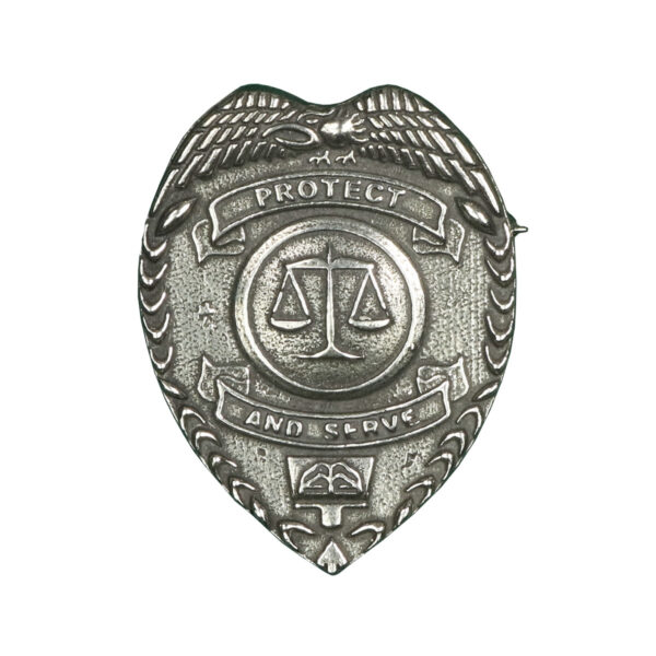 A Protect and Serve Law Enforcement Cap Badge adorned with wings on it.