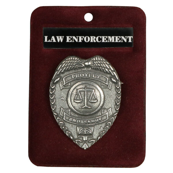 A Protect and Serve Law Enforcement Cap Badge securely kept in a red pouch.