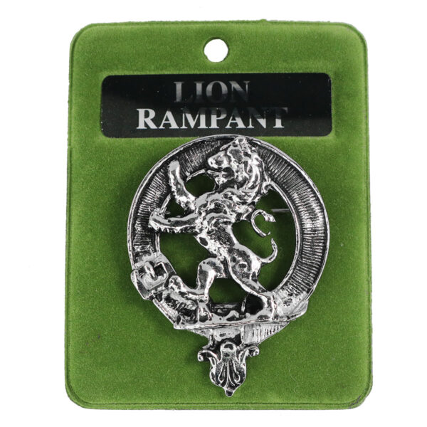 A silver Art Pewter Rampant Lion Cap Badge/Brooch on a pewter background.