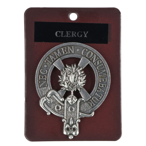 A clergy cap badge/brooch with the word clarey on it.