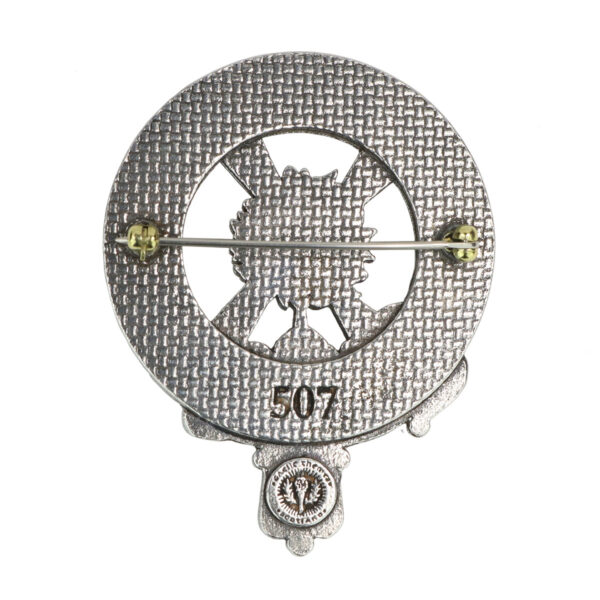 A silver Clergy Cap Badge/Brooch with the number 771 on it, worn as a lapel pin.