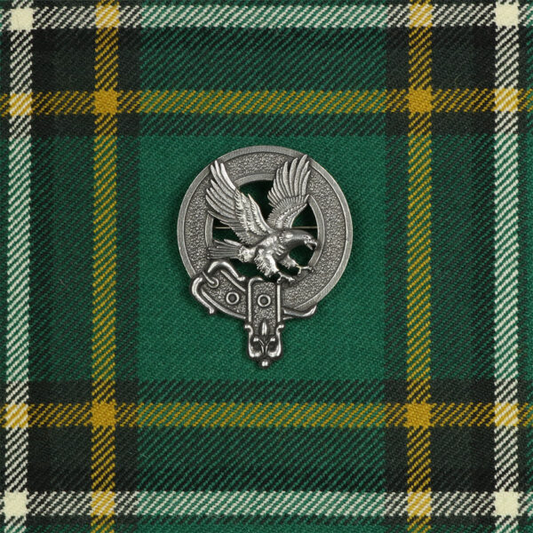 A Scottish tartan Scottish Eagle Cap Badge/Brooch with a green and yellow design, featuring an eagle.