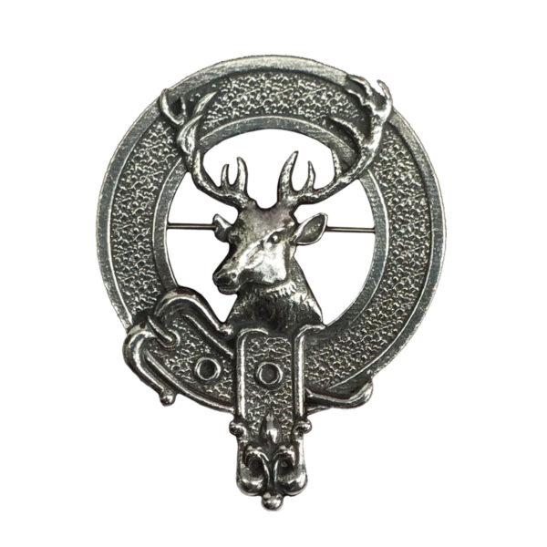 A Scottish Stag Cap Badge/Brooch adorned with silver stag antlers.