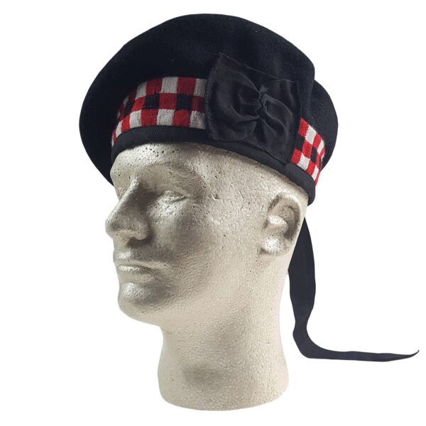 A mannequin wearing a black and red tartan Felted Wool Balmoral beret.