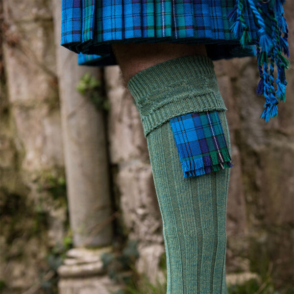 A person wearing Welsh Tartan Medium Weight Premium Wool Flashes kilt and socks.
