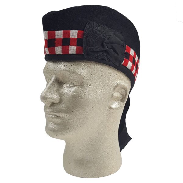 A mannequin wearing a black and red tartan Felted Wool Glengarry hat.