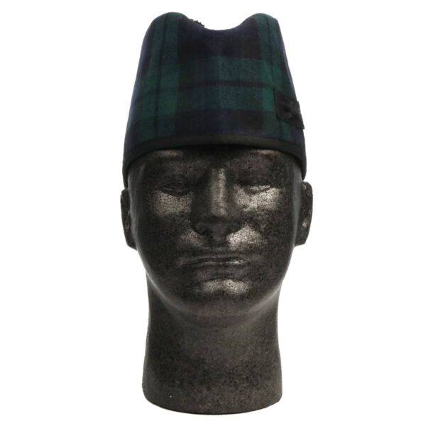 A mannequin wearing a green and black tartan hat.