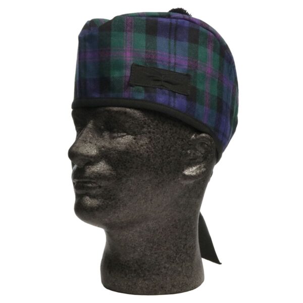 A mannequin wearing a tartan hat.