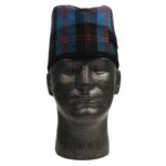 A mannequin wearing a plaid hat.