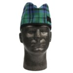 A mannequin wearing a green and black tartan hat.