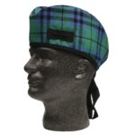 A mannequin wearing a green and blue tartan hat.