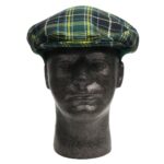 A mannequin wearing a green and black tartan hat.