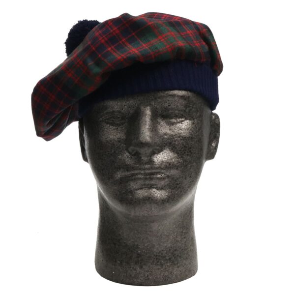 A mannequin wearing a tartan beret.