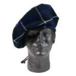 A mannequin wearing a Homespun Wool Blend Tartan Tam.