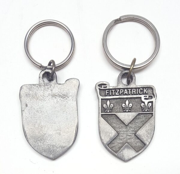 Two Irish Coat of Arms keychains featuring a shield and a cross. - Irish Coat of Arms Key Chain - Clearance - Weathered