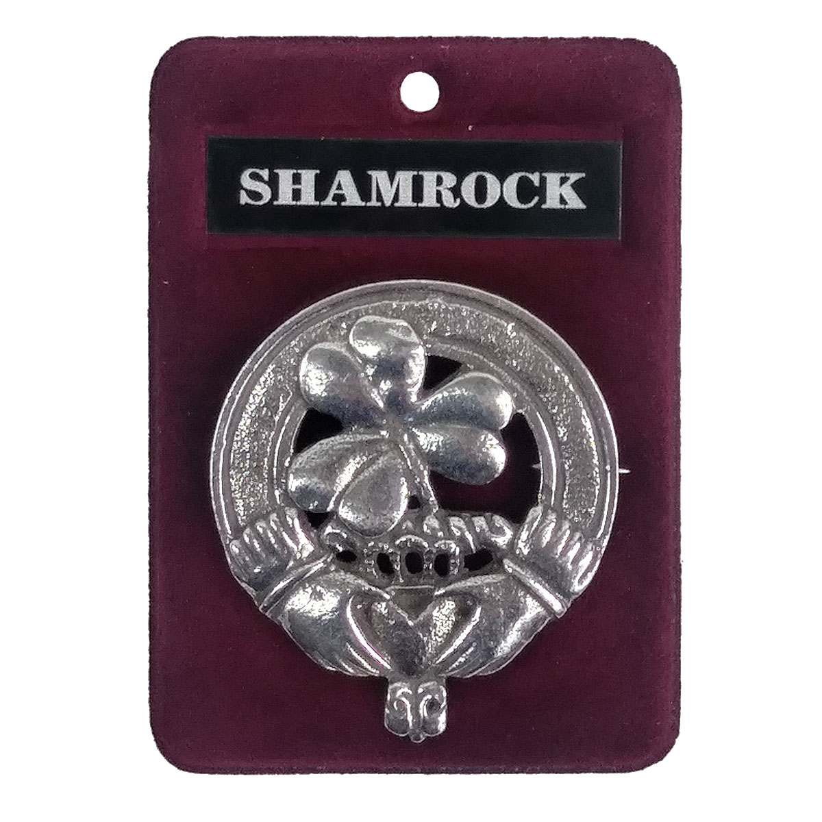 A silver Irish Shamrock Cap Badge/Brooch adorned with a shamrock.