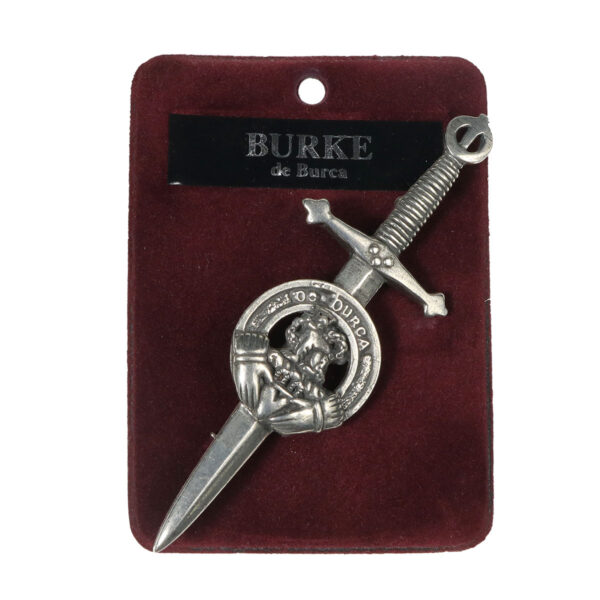 A silver Irish Family Crest kilt pin in a red pouch.