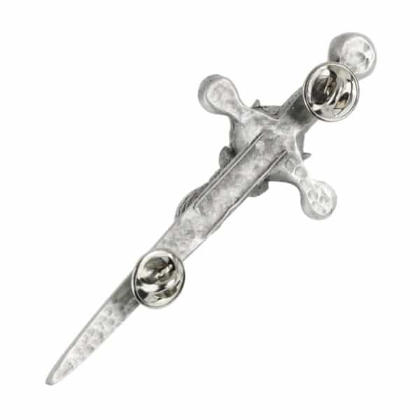 A silver sword with a cross and Stag's Head Kilt Pin on it.