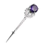 A Large Gem Amethyst Thistle Kilt Pin featuring a vibrant purple stone.