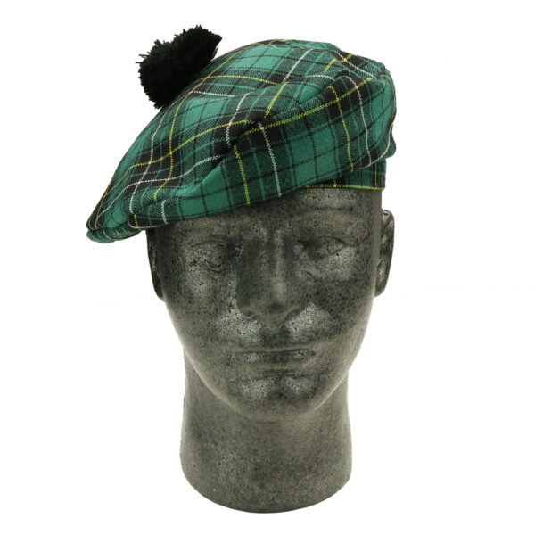 A mannequin wearing a MacAlpine Ancient Spring Weight 8oz Wool Tartan Balmoral beret.